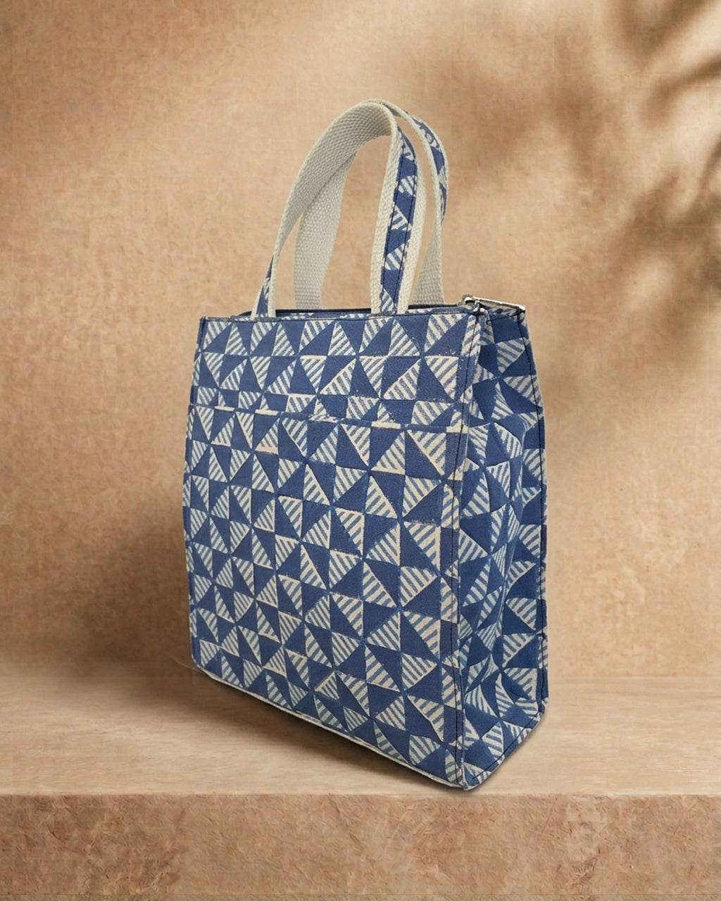 hand block printed back panel of a blue bag