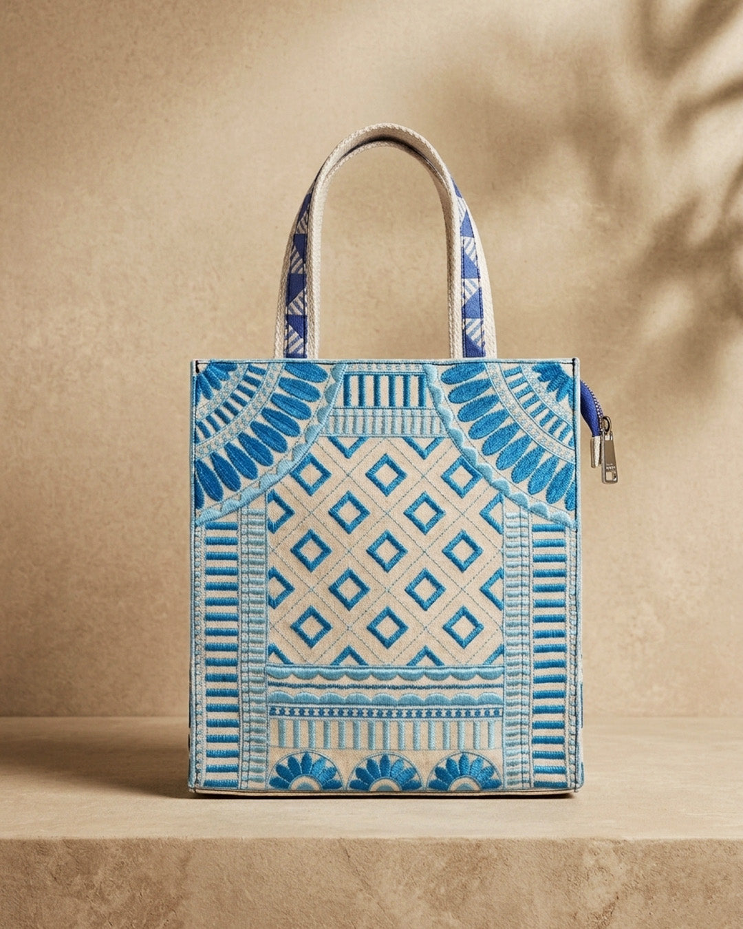Blue and beige patterned midsized tote bag on a beige background inspired by Jodhpur 